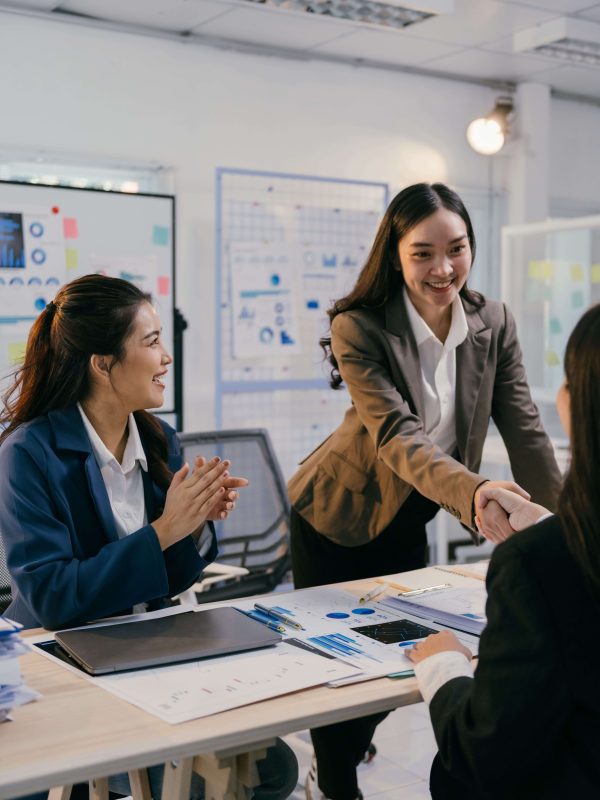businesswomen-shaking-hands-celebrating-successful-2026-01-07-05-38-25-utc (1)