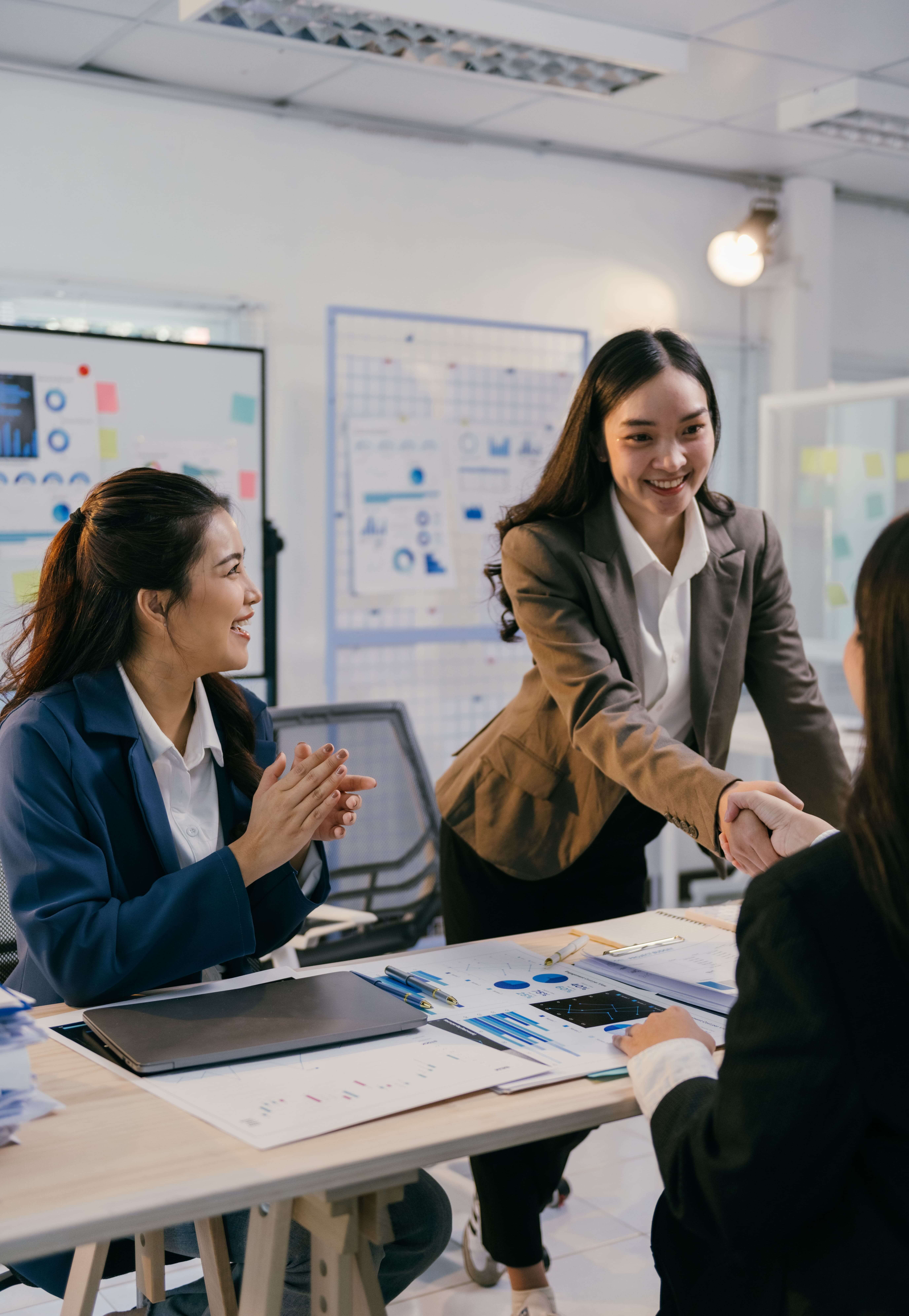 businesswomen-shaking-hands-celebrating-successful-2026-01-07-05-38-25-utc (1)